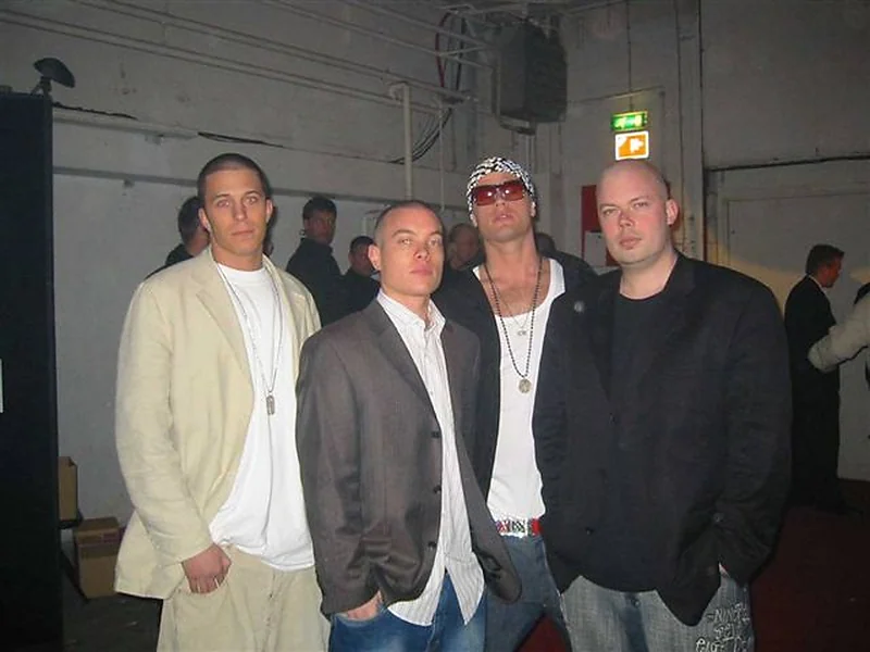 Jules Wolfson with Jon, Nik and Jay at an event, around 2004